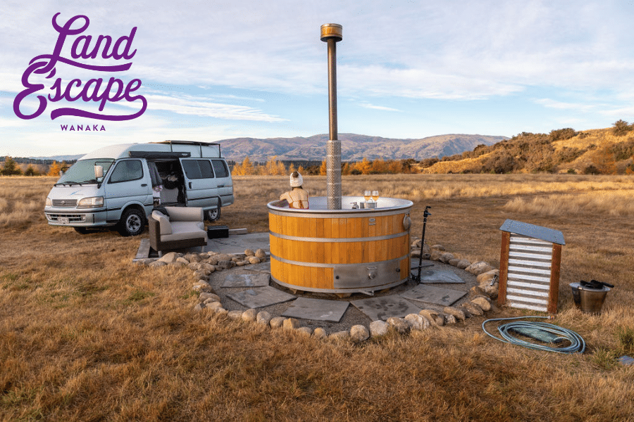 photograph of hit tub at LandEscape with a campervan and LandEscape logo
